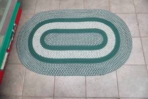 lot 219 image: Oval Braided Rug 49.5x 30