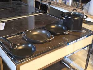 lot 65 image: Lot of (4) Cookware by Cirulon - Stock Pot 10Dx7 with Lid, 8-12 Pan, 10-12 Pan, 10-12 Wok