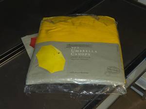 lot 138 image: World Market 9 Umbrella Canopy with Cover and Base (gold) (in original packaging)