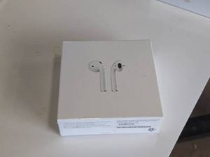 lot 26 image: Apple Air Pods with Wireless Charging Case A2032 A2031 A1938 (in original packaging)