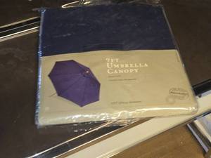 lot 141 image: World Market 9 Umbrella Canopy with Cover and Base (navy blue) (in original packaging)
