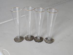 lot 204 image: Lot of (4) 9-12 Champagne Flutes - Gold Rimmed  Dark Grey Bottom Finish Glass