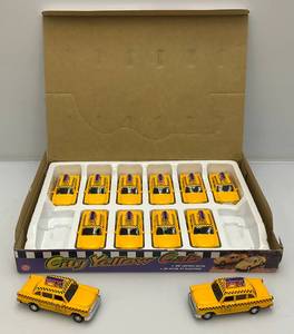 lot 59 image: New Old Stock Case Of City Yellow Cab Die Metal And Plastic Cast Taxis With Pull Back And Go Action