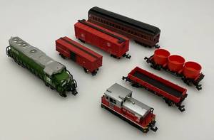 lot 69 image: Group Of N Scale Engines Including Burlington Northern With Pennsylvania & Misc. Train Cars And More