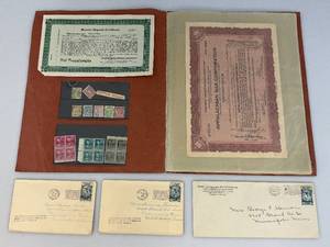 lot 74 image: Misc. 1920s Stock, Bonds And Stamps In Book