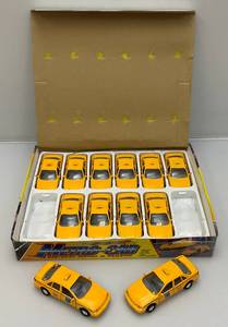 lot 100 image: New Old Stock Case Of Metro-Cab Die Metal And Plastic Cast Taxis With Pull Back And Go Action