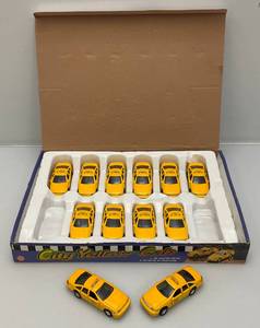 lot 101 image: New Old Stock Case Of City Yellow Cab Die Metal And Plastic Cast Taxis With Pull Back And Go Action