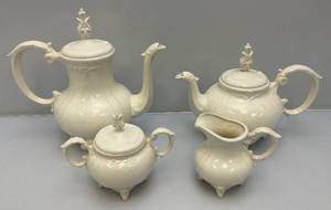 lot 210 image: 1973  Ornate Pottery Tea Set Marked JERRI On Bottom (One Teapot Lid Handle Glued)