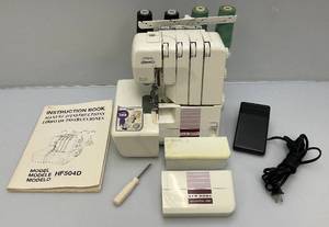 lot 244 image: New Home Differential Feed HF504D Serger With Manual