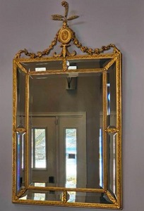 lot 60 image: Louis XVI Gilt Hall Mirror with Urn Rosette and Floral Swags