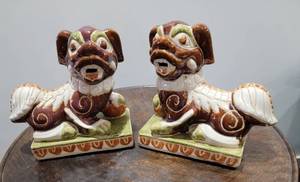 lot 32 image: Brown and White Foo Dog Statues