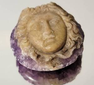 lot 78 image: Carved Medusa Face Amethyst Specimen