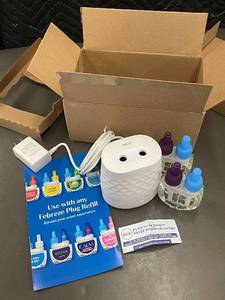 lot 81 image: Febreze Plug Scent Booster Kit with 4 Refills