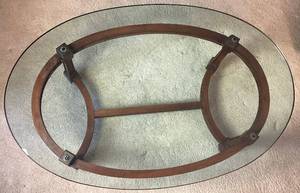 lot 45 image: Gabberts Wooden Coffee Table on Wheels with Oval Glass Top