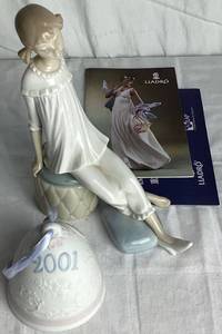 lot 21 image: Lladro Girl With Mothers Shoe Porcelain Figurine #1084 and 2001 Porcelain Christmas Bell Ornament