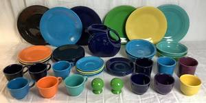 lot 17 image: Fiesta Dinnerware Set -6 Dinner Plates, 8 Salad Plates, 7  Saucers, 4 Bowls, 1 Pitcher, 9 Cups, Salt & Pepper Set and 3 Mugs