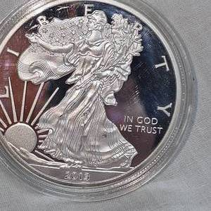 lot 72 image: 2013 Silver Eagle 100 Mills, .999 Silver Coin