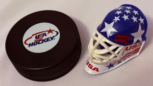 lot 123A image: Yeam USA Hockey Puck and Mini Goalie Mask Bottle Opener