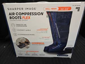 lot 39 image: Sharper Image Compression Boots Size SM -MED 50 to 58
