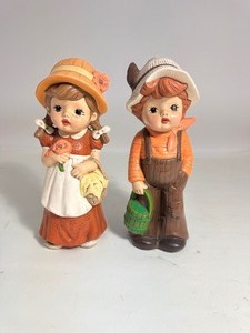lot 26 image: Boy & Girl Ceramic Figurines