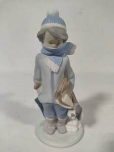 lot 61 image: Lladro Winter Boy with Dog Porcelain Figurine (#5220)