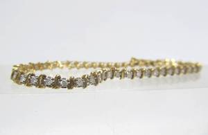 lot 25 image: Genuine 14K Gold Tennis Bracelet