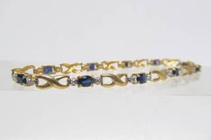 lot 28 image: Genuine 10K Gold Tennis Bracelet