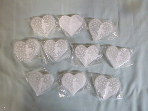 lot 42 image: 10 Selenite Crystal Hearts with Fairies on them.