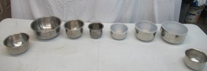 Assorted vintage stainless steel mixing bowls. Some with covers.