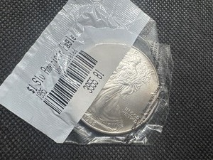 lot 51 image: 1995 Uncirculated American Silver Eagle in sealed Littleton package