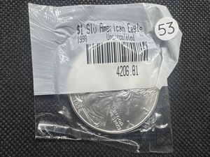 lot 53 image: 1998 Uncirculated American Silver Eagle in sealed Littleton package