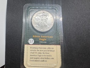 lot 57 image: 2000 Uncirculated American Silver Eagle in sealed Littleton  holder
