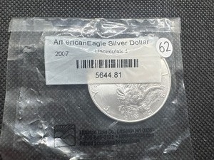 lot 62 image: 2006 Uncirculated American Silver Eagle in sealed Littleton package