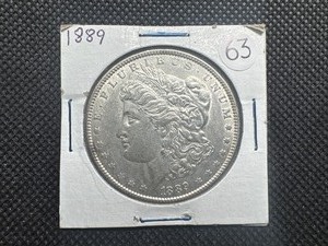 lot 63 image: 1889 Morgan Silver Dollar