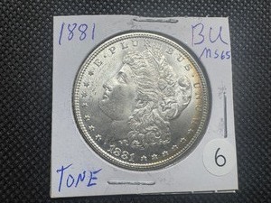 lot 6 image: 1881 Morgan Silver Dollar Marked BU MS65 Tone When Purchased