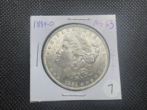 lot 7 image: 1884-O Morgan Silver Dollar Marked MS63