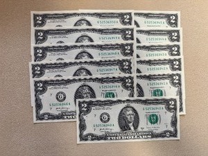lot 100 image: Eleven Sequential $2 Bills