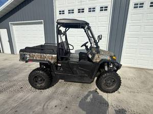 lot 1 image: Coleman 750 UTV