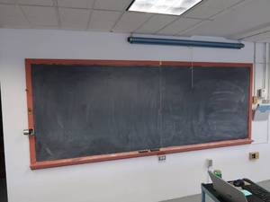 lot 35 image: LARGE CHALK BOARD AND ROLL UP PROJECTOR SCREEN