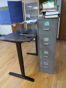 lot 375 image: UPLIFT TABLE, FILING CABINET, AND SCHOOL BOOKS