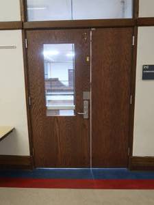 lot 505 image: WOODEN DOOR WITH BULLETPROOF GLASS PANEL
