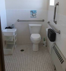 lot 587 image: TOILET, SINK, AND MIRROR