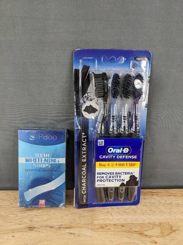 lot 142P image: 28 Pdoo Teeth Whitening Strips & 4 Oral-B Cavity Defense Toothbrushes - Brand New
