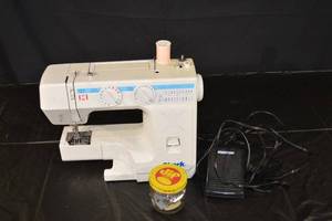 lot 222 image: Shark Portable Sewing Machine with Foot Pedal & Accessory Jar