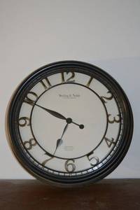 lot 293 image: Sterling & Noble Clock Company Wall Clock - Mfg No. 9 - Black Frame, Gold Numerals