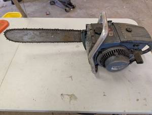 lot 61 image: Homelite Direct-Drive Chain Saw - Vintage Gas-Powered Tool