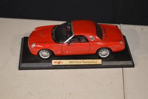 lot 171 image: Maisto 2002 Ford Thunderbird Die-Cast Model Car - Red with Display Base