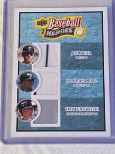 lot 27 image: Joe Mauer, Hanley Ramirez, Troy Tulowitzki 2008 Upper Deck Baseball Heroes Triple Relic #192 - MLB Baseball Card
