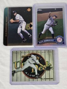 lot 61 image: Lot of 3 Alex Rodriguez Baseball Cards including Rookie, Refractor and Insert