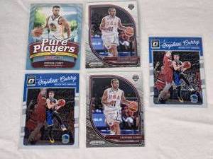 lot 128 image: Lot of 5 Stephen Curry Basketball Cards Including Panini Prizm and Donruss Optic with USA and Golden State Warriors Themes